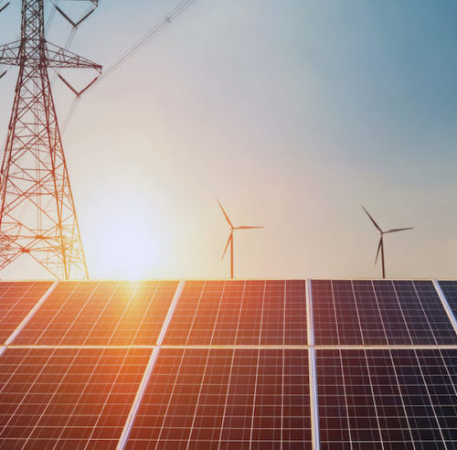 Solar panels with electricity pylon and wind turbine