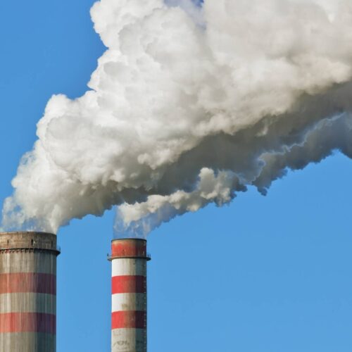 smoke stacks releasing gas