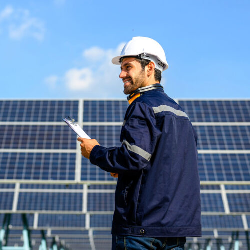 technician working on solar panel array