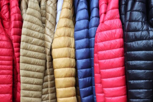 multicolor puffy winter jackets hanging