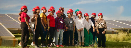 WIRE group standing in front of solar field